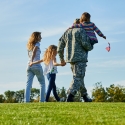 Family walking across a field